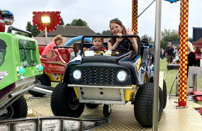 Greg's son and wife enjoying the Monster Trucks ride.