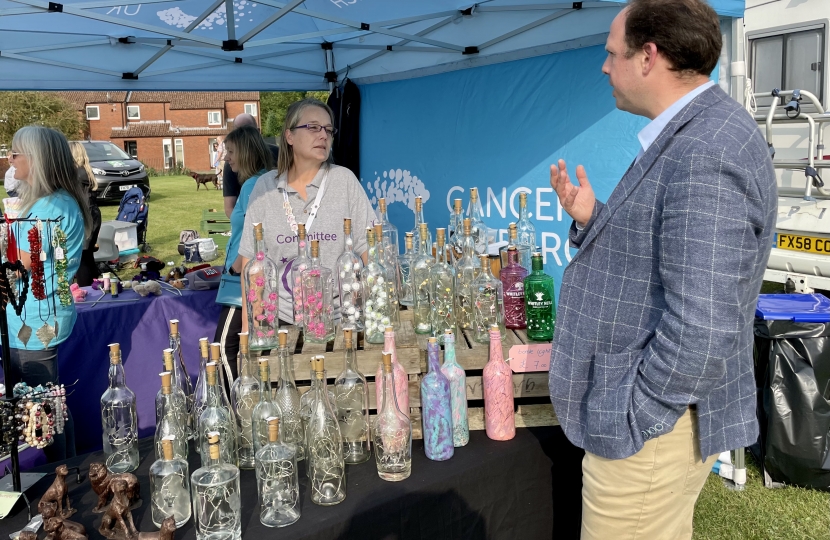 Greg at the Cancer Research stall.