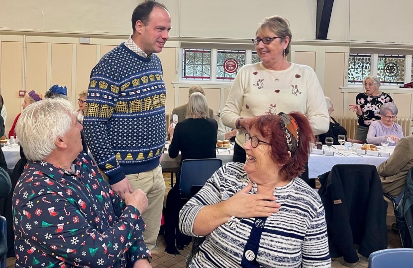 Greg chats to guests at the Steeple Claydon Seniors Christmas Dinner 2021.