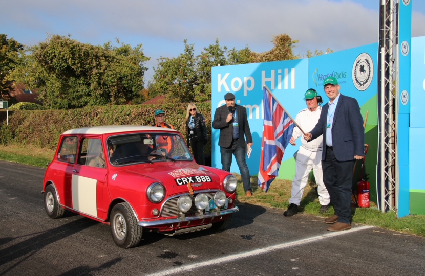 Greg waves the starting flag for the Kop Hill Climb 2022