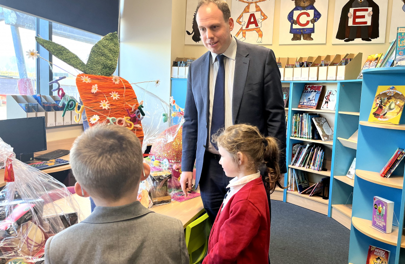 Greg awards prizes for Lace Hill Academy Easter Bonnet Competition