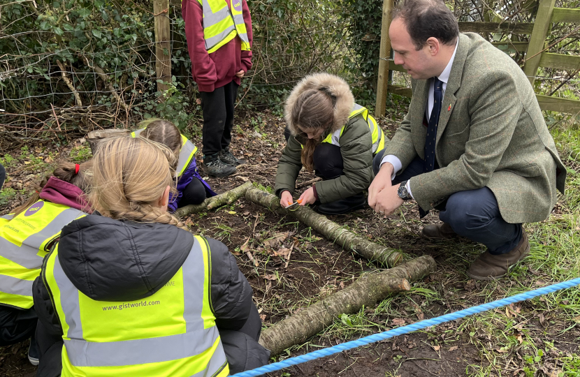 Greg chats to forest school pupils learning how to safely start a fire.