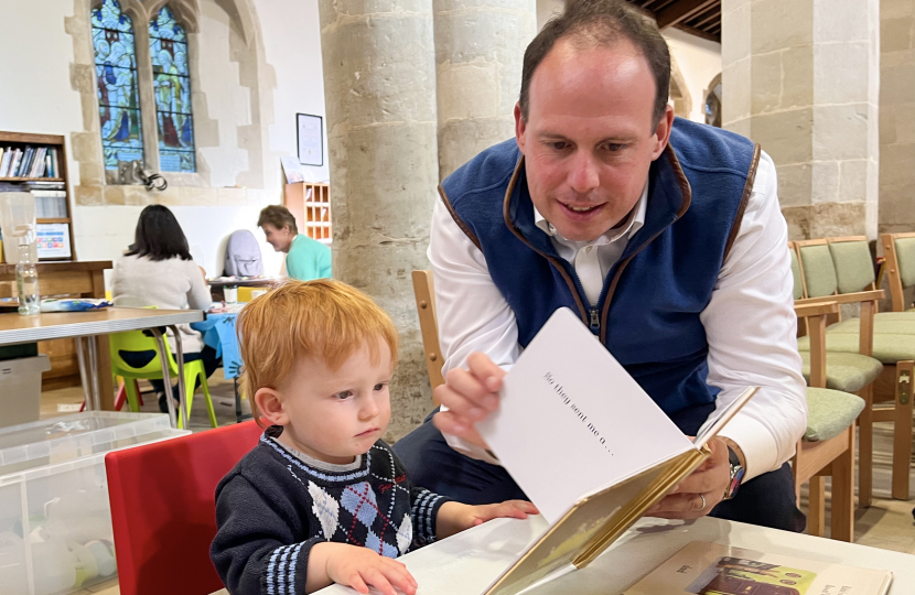 Greg's 1 year old son enjoying the play cafe book table.