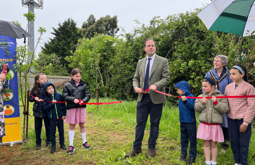 Greg cuts the ribbon to open Lace Hill Community Orchard