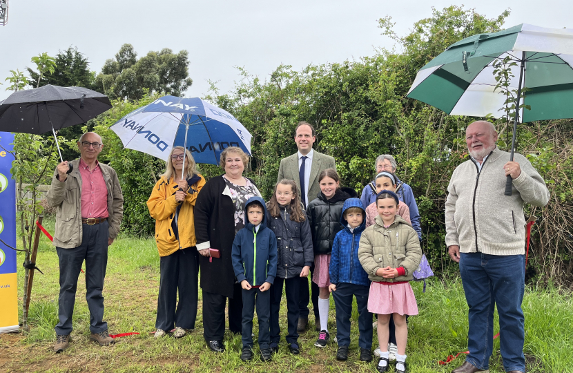 Greg cuts the ribbon to open Lace Hill Community Orchard