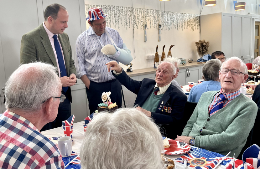 Greg helps out at over 65s Coronation tea at the Princes Centre