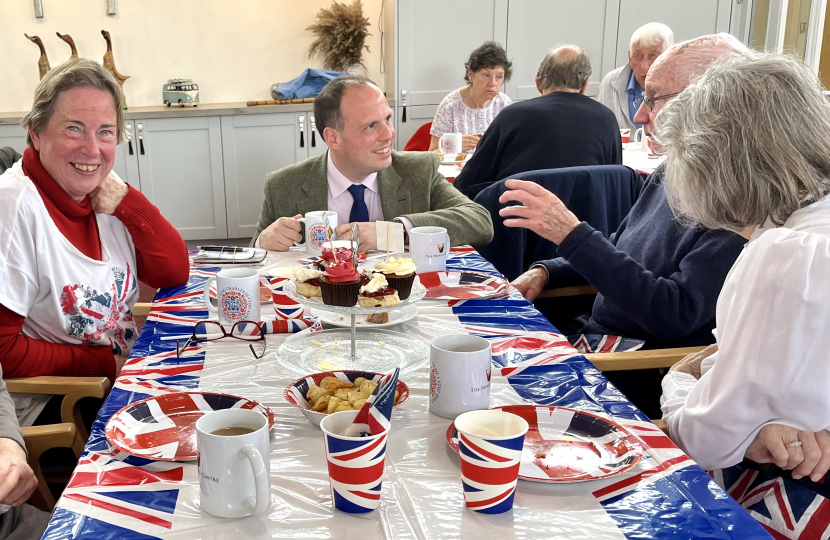 Greg helps out at over 65s Coronation tea at the Princes Centre