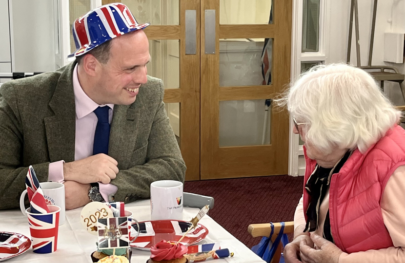 Greg helps out at over 65s Coronation tea at the Princes Centre