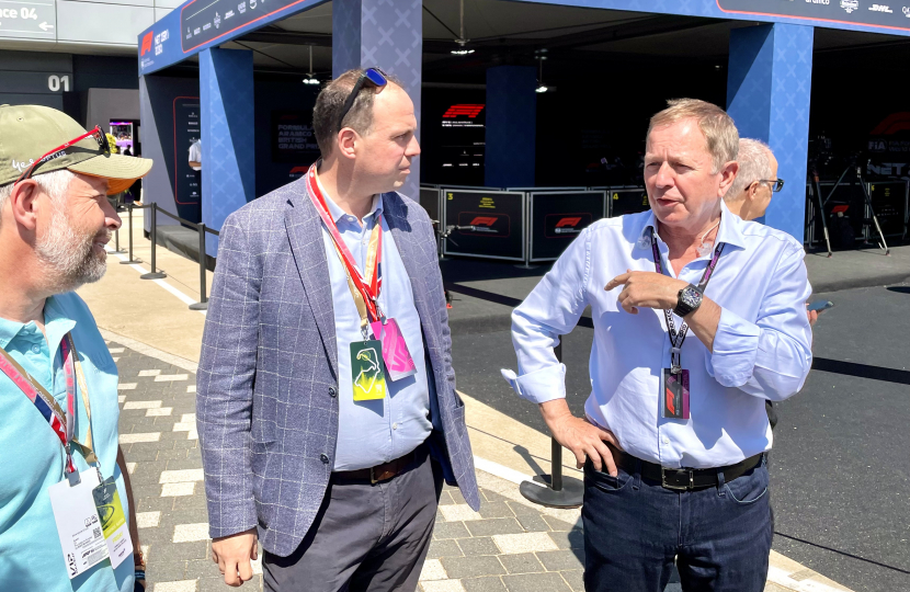 Greg with Martin Brundle in the F1 Paddock.