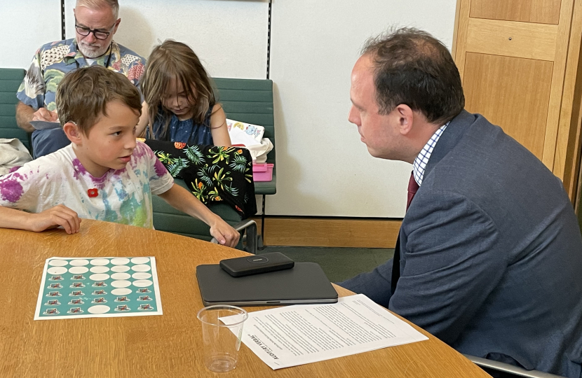 Greg with eight-year-old Orson Grimer who was born prematurely and diagnosed with hearing loss in both ears at his new born hearing screening.