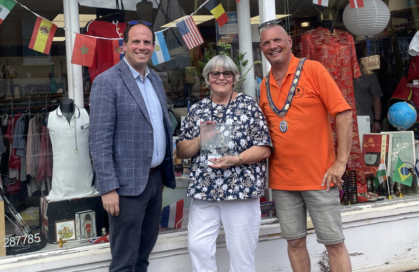 Greg and Andy Ball congratulate Shaw Trust on winning the window display competition.