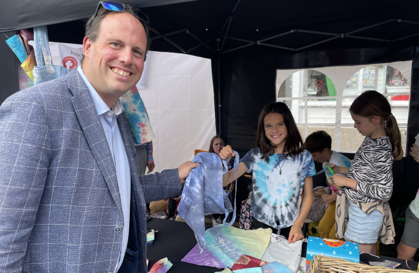 Greg supporting local young budding entrepreneur Amelie's tie dye stall.