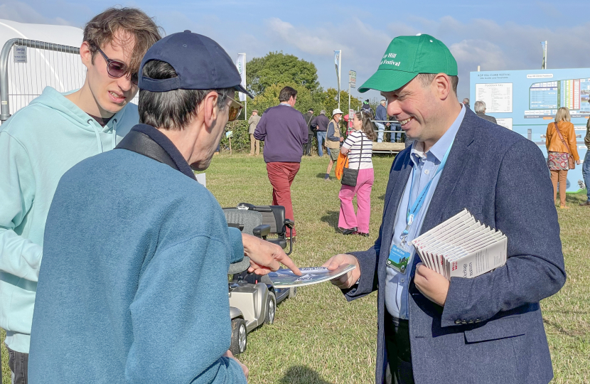 Greg selling programmes in aid of the Kop Hill Climb Fund which is distributed to Bucks charities