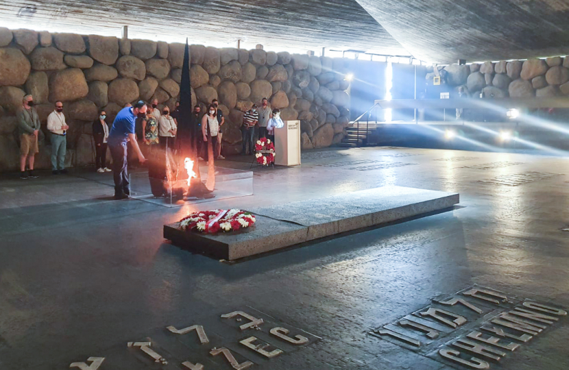 Greg rekindles the flame as part of a ceremony of remembrance at Yad Vashem.