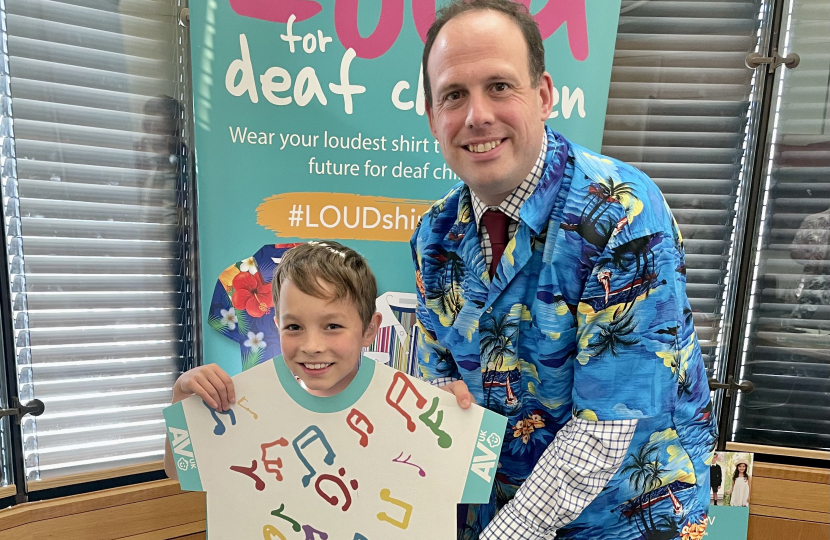 Greg with eight-year-old Orson Grimer who was born prematurely and diagnosed with hearing loss in both ears at his new born hearing screening.