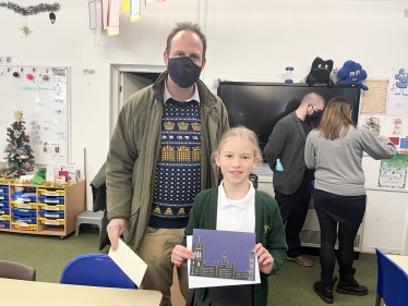 Greg with 2021 MPs Christmas Card Competition Winner, Florrie.