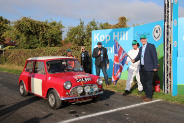 Greg waves the starting flag for the Kop Hill Climb 2022