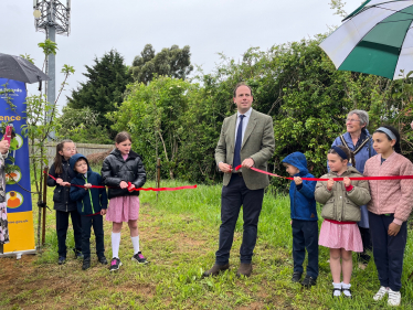 Greg cuts the ribbon to open Lace Hill Community Orchard