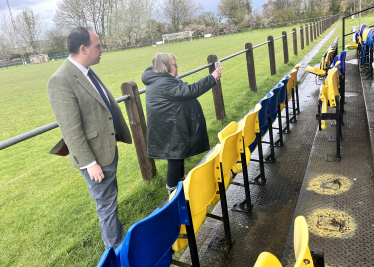 Greg sees the damage to the football seating.