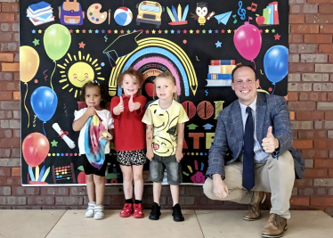 Greg presents graduation certificates at Longwick Pre-School