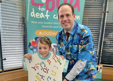 Greg with eight-year-old Orson Grimer who was born prematurely and diagnosed with hearing loss in both ears at his new born hearing screening.